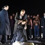 Отелло (Марко Берти) унижает Дездемону (Светлана Аксенова) к большому удовольствию Яго (Клаудио Сгура). Фото - Hans JOrg Michel